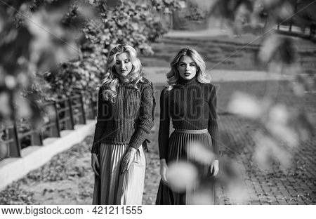Forest Foliage. Sunny Day With Fallen Leaves. Fall Fashion Season. Pleated Trend. Girls In Corrugate