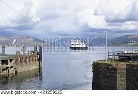Ferry Ship Arriving At Scottish Island Of Rothersay
