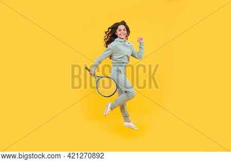 Happy Energetic Kid Jump In Sportswear With Squash Racquet Running To Success, Stamina.