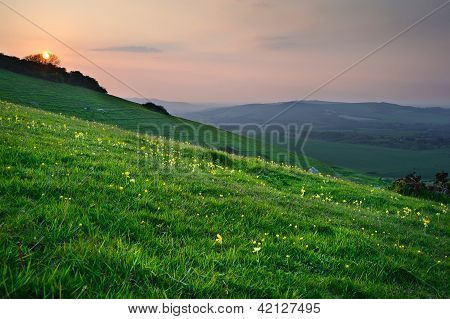 Sunset Over Lush Green Countrysidel Landscape