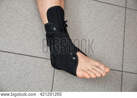 The Male Leg Is Fixed In A Medical Bandage. Ankle Fracture Or Sprain. Lacing And Tight Fit Of The Fo