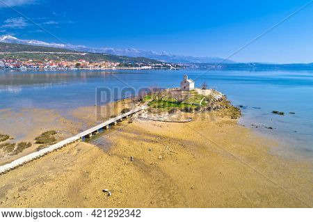 Small Island Church And Coastal Town Of Posedarje Aerial View, Dalmatia Region Of Croatia