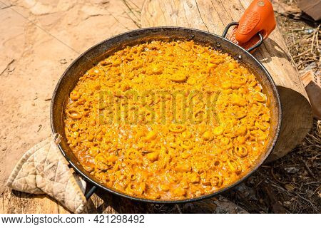 Preparation Of The Embers Of The Valencian Paella With Embers And Vegetables. Traditional Spanish Fo