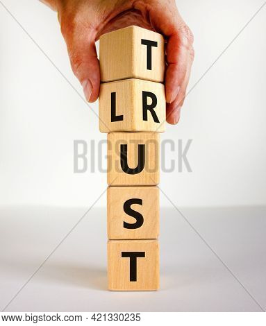 Lust Or Trust Symbol. Businessman Turns Wooden Cubes And Changes The Words 'lust' To 'trust'. Beauti