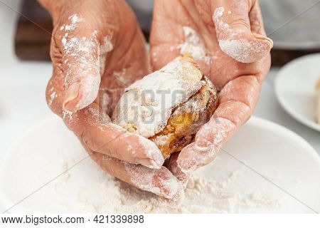Senior Woman Preparing A Traditional Dish From El Valle Del Cauca In Colombia Called Aborrajado