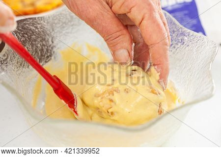 Senior Woman Preparing A Traditional Dish From El Valle Del Cauca In Colombia Called Aborrajado