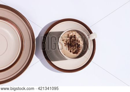 Milk Coffee Served In A Small Glass, In A Photo With A Minimalist Concept On A White Background.