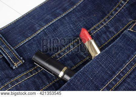 Mascara And Lipstick In Pocket Of Blue Jeans. Concept Of Fashion Lifystyle.