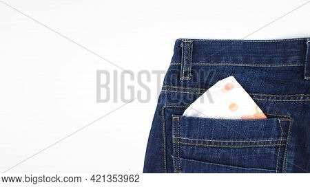 Menstrual Pad In Pocket Jeans. Woman Pad In The Pocket Of Female Jeans.