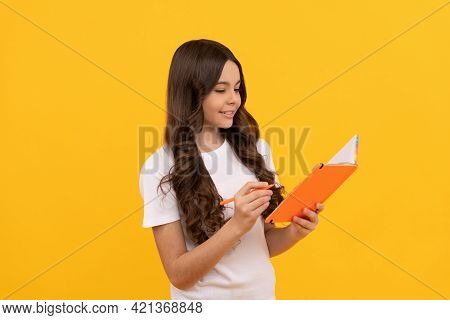 Smiling School Teen Girl Ready To Study Making Notes In Copybook, Education