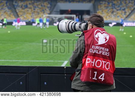 Kyiv, Ukraine - March 28, 2021: Photographer At Work Seen During The Fifa World Cup 2022 Qualifying 