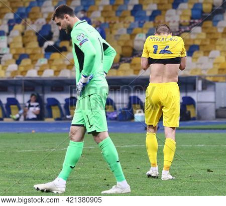 Kyiv, Ukraine - March 28, 2021: Goalkeeper Georgiy Bushchan Of Ukraine Reacts While Vitaliy Mykolenk
