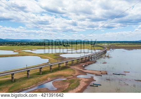 Aerial View Of The Railway Bridge Over A Reservoir In Pasak Chonlasit Dam On Summer Season At Lopbur
