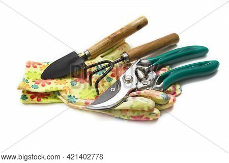 Garden Tools Garden Scissors, Gloves, Rake And Shovel Isolate On A White Background. The Concept Of