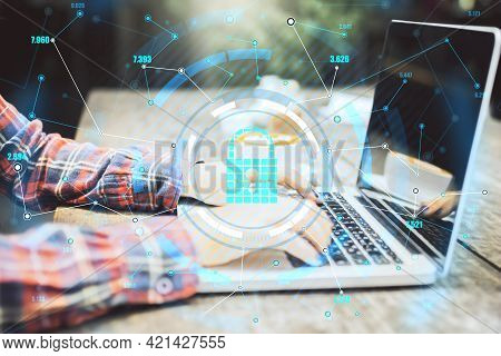 Encircled Keylock Hologram Icon With Hands Typing On The Laptop Keyboard, Data Safety And Cybersecur
