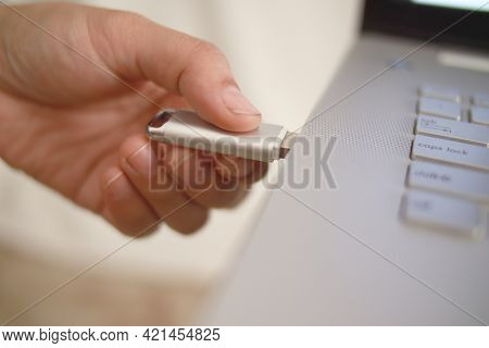 Person Inserting Plug In Flashdisk Into Usb Port In Laptop Personal Computer, Data Transfer Device C