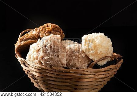 Cocada, Coconut Candy From Brazil, White And Brown Cocadas In A Straw Basket On Dark Surface, Black