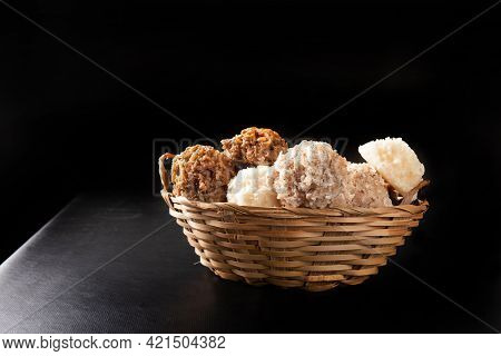 Cocada, Coconut Candy From Brazil, White And Brown Cocadas In A Straw Basket On Dark Surface, Black