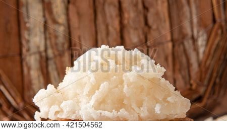 Cocada, Coconut Candy From Brazil, White And Brown Cocadas In Close Up On A Rustic Wooden Surface An