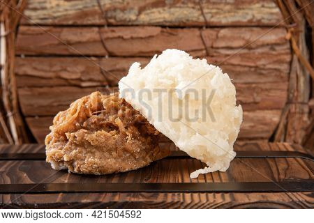 Cocada, Coconut Candy From Brazil, White And Brown Cocadas In Close Up On A Rustic Wooden Surface An