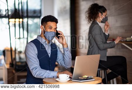 Business People With Laptop Working In Cafe, Small Business, Coronavirus And New Normal Concept.