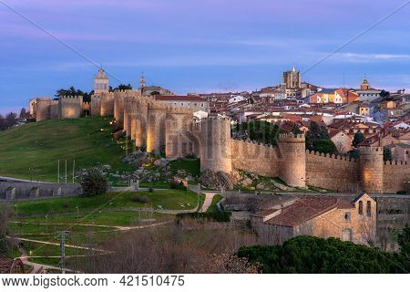 Walls Of The City Of Avila (world Heritage Site By Unesco) And Cuatro Postes Lookout Monument Illumi