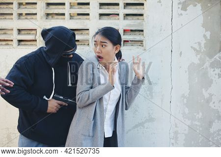 Thief Armed Man Rob Woman By Gun On Street So Scared Shocked Face. Frightened Asian Woman Was Rob Ag