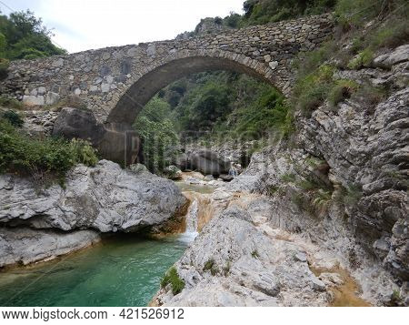 Stone Bridge In The Nervia Valley View Near The Rio Barbaira Stream, Rocchetta Nervina, Liguria - It