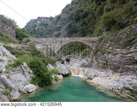 Stone Bridge In The Nervia Valley Near The Rio Barbaira Stream, Rocchetta Nervina, Liguria - Italy