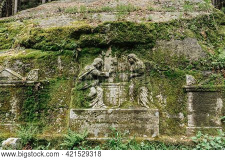 Ostas,czech Republic - May 21,2021. Sculptures Called Samaritan Carved Into Sandstone Rock In Close 