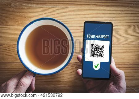 Covid Passport Certificate (covidpass) Concept With Smart Phone. Person Looking On Personal Covid Pa