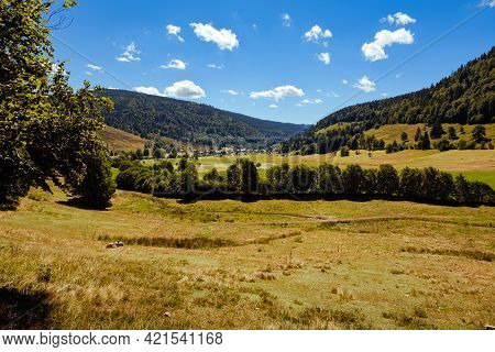 A Landscape With Pastures, Trees And Hills In The High Black Forest In Summer Near The Village Of Me