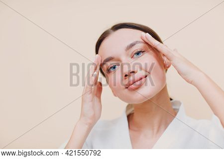 Young Woman Doing Facebuilding Yoga Face Gymnastics