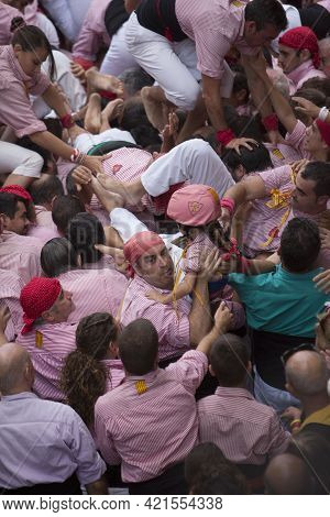 Tarragona, Spain, September 19, 2019 - Castellers Sprawl On People After Human Tower Castells Collap