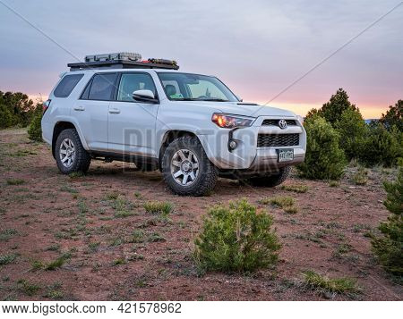 Dinosaur National Monument, CO, USA - May 18, 2021: Toyota 4Runner SUV (2016 Trail model) at dawn in arid landscape of north western Colorado along Yampa Bench Road, springtime morning scenery.