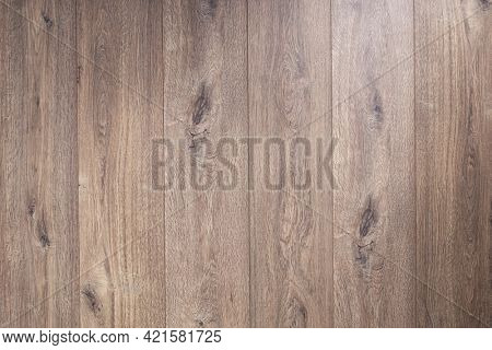 Laminate floor background texture. Wooden table top or wood laminate floor with copy space