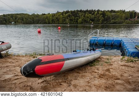Paddle Board On The Beach On The Lake Background