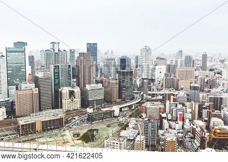 Osaka, Japan - 18 May, 2015: View From Above On Osaka City With Skyline With Skycrapers, Highways An