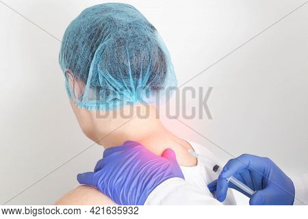 The Doctor Makes A Medical Blockade In The Cervical Spine Of A Girl With A Chondroprotector To Resto