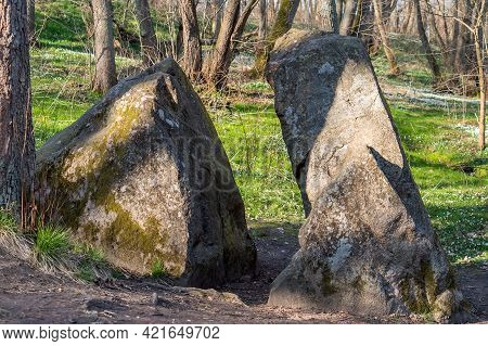 A Stone Of Lies. A Huge Rock In The Woods. A Large Boulder In The Woods. A Splintered Boulder. Kalin