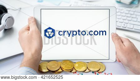 Russia Moscow 06.05.2021.businessman With Tablet.logo Of Cryptocurrency Stock Exchange Crypto.com.tr