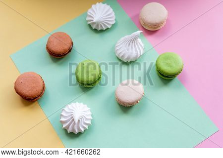 Pop Art Color Style Macaroons And Bakery Goodies On Bright Colorful Background.variety Of Macaroons.