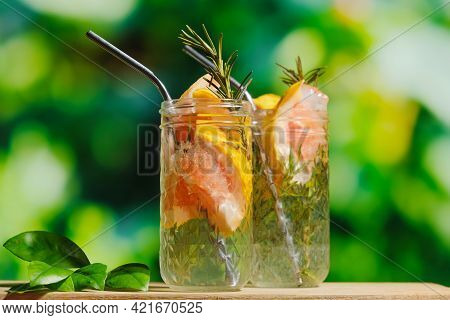 Summer Drinks Concept, Outdoors Cocktail Party. Two Hard Seltzer Cocktails With Grapefruit Slices An