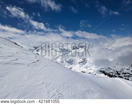Ski Mountaineering In The Beautiful Swiss Alps. Winter Landscape In The Grisons Mountains Near The E
