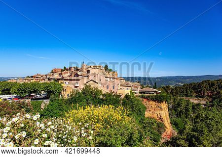 The village of Roussillon is surrounded by picturesque ocher cliffs. Bizarre ocher rocks, where the pigment quarry used to be. France, Provence