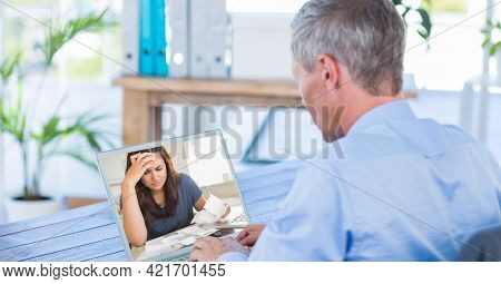 Composition of male doctor during online consultation. global online medicine and technology concept digitally generated image.