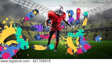 Composition of american football player over colourful handprints and sports stadium background. sports event and competition concept digitally generated image.