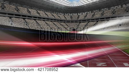 Composition of sports stadium with red and white light trails. sports event and competition concept digitally generated image.