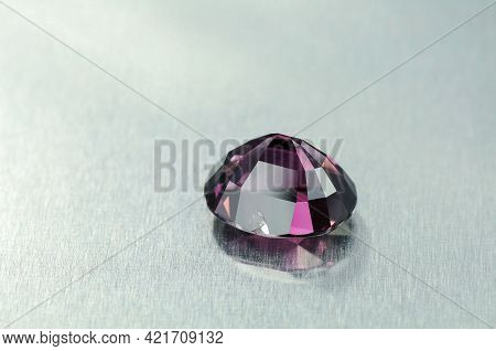 Natural Faceted Purple Spinel Semiprecious Gemstone Upside Down Culet. Chip On Facet. Close Up Detai