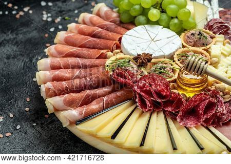 Antipasto With Traditional Spanish Meat And Cheese Snacks On Wooden Board And White Background, Dinn